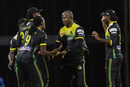 Some of the Tallawahs players including Dwayne Smith,  Steven Jacobs, and Chris Gayle celebrate their unlikely win. Photo courtesy CPL)