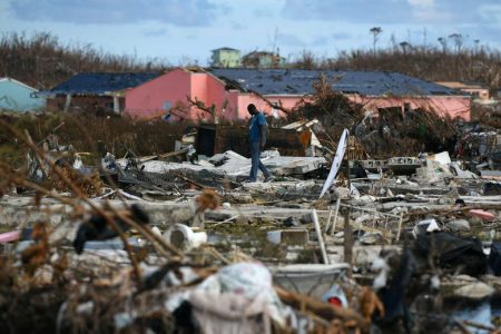 A man searches for belongings amongst debris in a destroyed neighborhood in the wake of Hurricane Dorian in Marsh Harbour, Great Abaco, Bahamas, September 8, 2019. REUTERS/Loren Elliott
