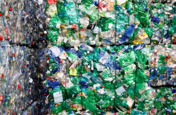 Bundles of pressed PET bottles made out of plastic are seen at the Transcycle Transport & Recycling AG company in Neuenhof, Switzerland November 22, 2018. (REUTERS/Arnd Wiegmann/File Photo)
