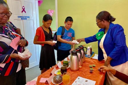 Nutritionist, Iverene Phillips (left) gave out samples of the natural teas to patients at the CIG.

