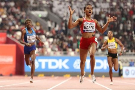 Bahrain’s Salwa Eid Naser celebrates winning gold in Doha yesterday. (REUTERS/Lucy Nicholson)
