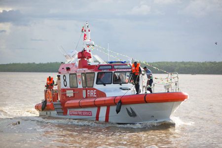 The Guyana Fire Service’s new boat in the Demerara River yesterday.  (Department of Public Information photo)