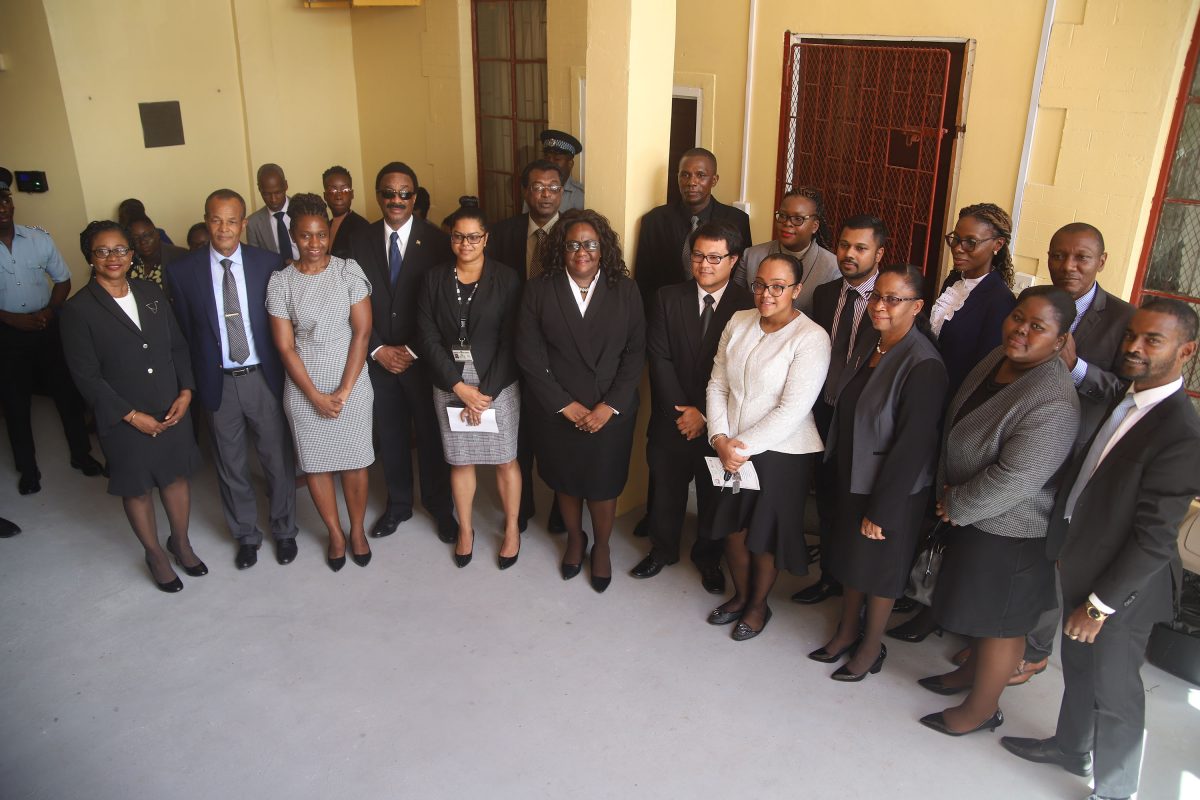 Acting Chancellor Yonette Cummings-Edwards, NANA Director Michael Atherly, Attorney-General Basil Williams, Minister of Public Security Khemraj Ramjattan and acting Chief Justice Roxane George stand in front of the Drug Treatment Court with the magistrates who have been trained for the administration of the new court.
