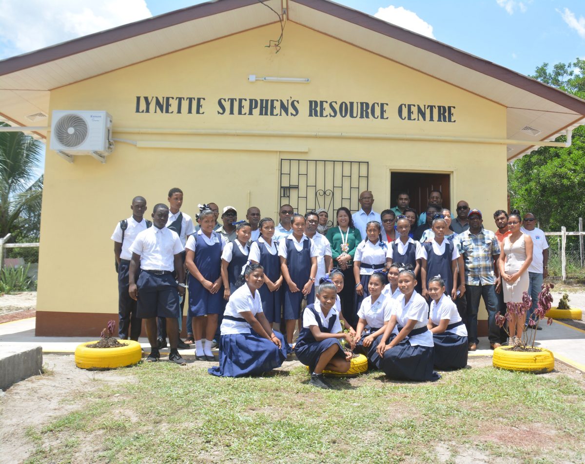 Minister of State Dawn Hastings-Williams (centre) along with Coordinator, Department of Social Cohesion Natasha Singh-Lewis, Mahdia Mayor David Adams, Regional Chairman Bonaventure Fredericks, Regional Executive Officer Mitzy Campbell, Lynette Stephen, donors and students of the Mahdia Secondary School at the opening ceremony of the Lynette Stephen Resource Centre. (Ministry of the Presidency photo)
