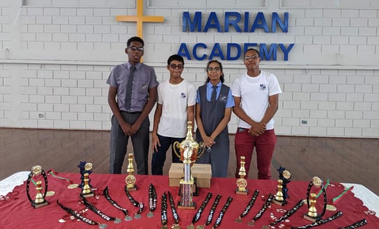 First place winners St Stanislaus College. From left are Jaden Taylor, Ghansham Alijohn, Chelsea Juma and Jorrel Troyer (Photo by John Lee)