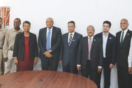 Minister of Natural Resources Raphael Trotman (fifth from left) with delegation members and others.