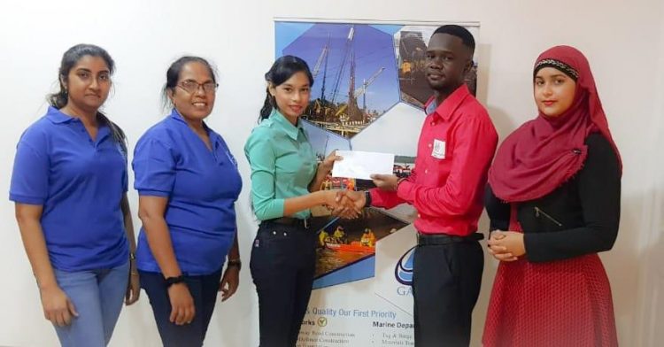 Gaico Construction etched its name in the Grand Prix series of the Guyana Chess Federation (GCF) through a donation of $320,000 in prizes for four tournaments. Office Manager of Gaico Champa Maraj, in handing over the cheque, said: “GAICO is a 100% Guyanese company and Managing Director Komal Singh is always in support of Guyanese activities which promote youth initiatives and harmony.” GCF Treasurer Davion Mars received the cheque and expressed his gratitude to Gaico for being the premier sponsor of the Grand Prix series. At the ceremony, Mars outlined the purpose of the four competitions. 
