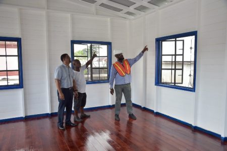 From left, City Councillors, David Allicock and Heston Bostwick along with M&CC City Engineer Rashid Kellman carrying out inspections on the rehabilitated office to house the City Constabulary. (DPI photo)