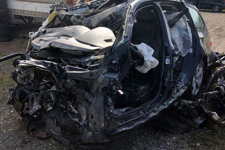 This Tuesday, Oct. 1, 2019 photo, released by the Ontario Provincial Police, shows the a smashed up vehicle involved in a fatal crash with transport truck near Shelburne, Ontario. Canadian police say the Jamaican dancehall reggae artist and actor known as Louie Rankin died Monday, Sept. 30, 2019, in the car crash involving a transport truck.