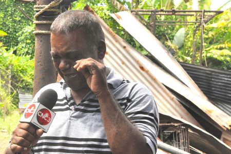 Baldeo Soogrim weeps as he recalls how his home was destroyed by fire on Sunday.