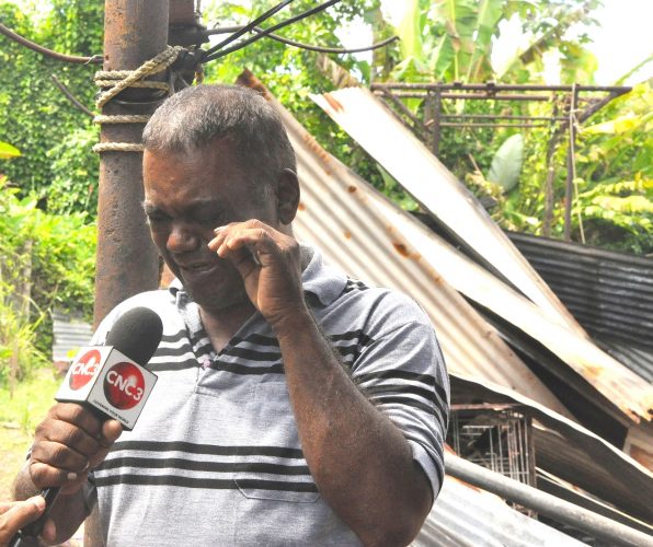 Baldeo Soogrim weeps as he recalls how his home was destroyed by fire on Sunday.