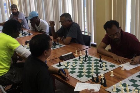 Action in Thursday’s opening round of the second GAICO sponsored chess tournament organized by the Guyana Chess Federation.
