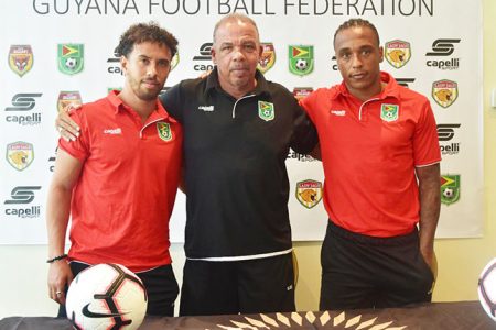 Senior Trio-Golden Jaguars tactician Marcio Maximo [center] flanked by captain Sam Cox [right] and Neil Danns following the conclusion of the pre-match press conference for the pivotal Antigua and Barbuda clash in League-B of the CONCACAF Nations League at the National Track and Field Center, Leonora.