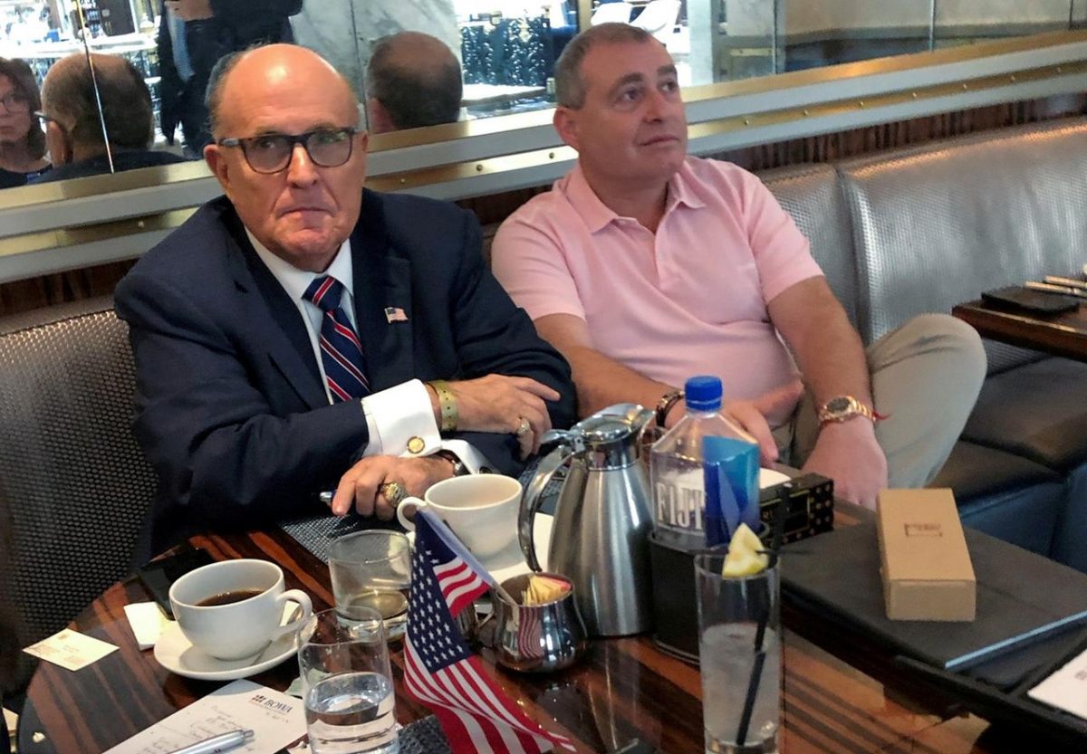 U.S. President Donald Trump's personal lawyer Rudy Giuliani has coffee with Ukrainian-American businessman Lev Parnas at the Trump International Hotel in Washington, U.S. September 20, 2019. REUTERS/Aram Roston/File Photo