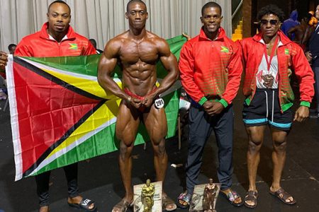Kerwin Clarke and Yannick Grimes pose with their hardware. They are flanked by Emmerson Campbell (left) and Guyana’s other representative, Darius Ramsammy. 