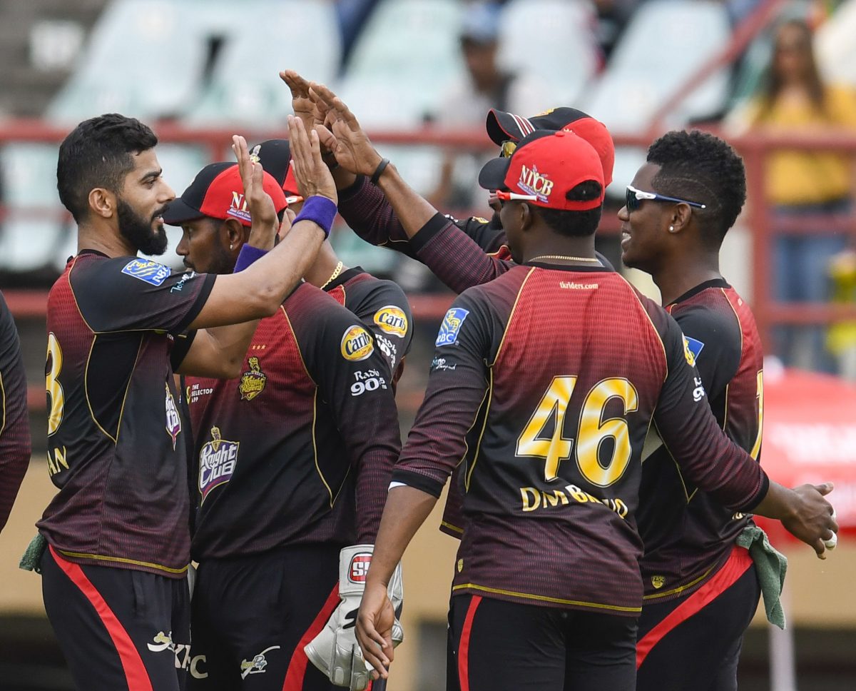 Ali Khan (L) of Trinbago Knight Riders celebrates the dismissal of Mohammad Hafeez of St Kitts and Nevis Patriots at the Guyana National Stadium yesterday. (Photo by Randy Brooks - CPL T20 via Getty Images)