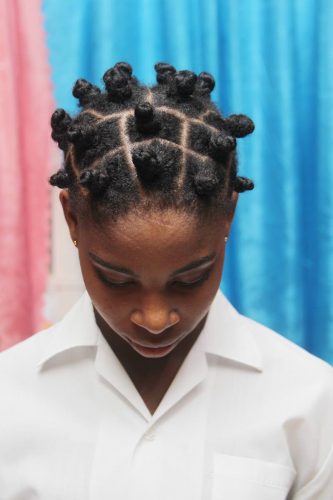 This St Stephen's College student's Bantu knots led her to be warned by school officials about her hairstyle. Her mother's complaint against the school is being investigated by the Education Ministry.