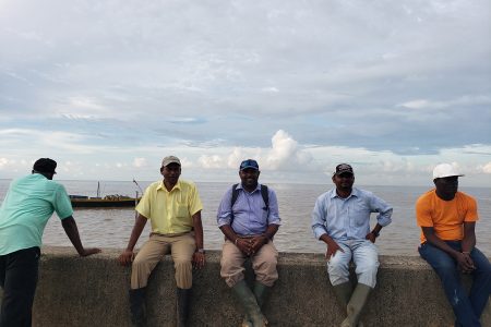 Ravindra Ramnarine (second from right) along with other members of the supervising team after the repairs on the temporary concluded. 