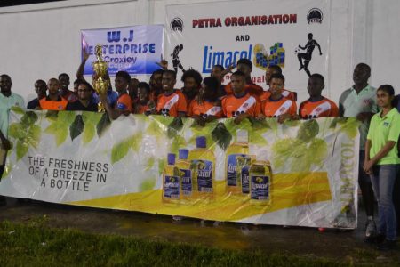 The victorious Fruta Conquerors U20 side celebrating their victory over Santos to claim the Limacol Football Championship at the Ministry of Education ground, Carifesta Avenue
