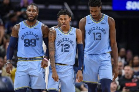 Memphis Grizzlies forward Jae Crowder (99) and guard Ja Morant (12) and forward Jaren Jackson Jr. (13) walk back up court during the second half against the Brooklyn Nets at the FedExForum. Mandatory Credit: Jerome Miron-USA TODAY Sports