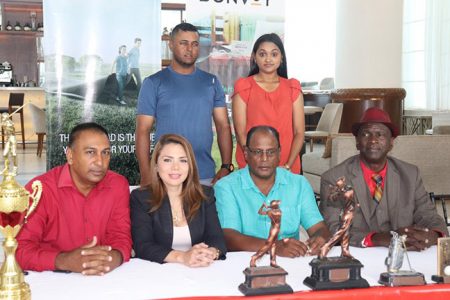 Standing at the back, nine-time defending champion, Avinash Persaud and acting club captain, Dr. Joaan Deo while seated from left are Club President, Aleem Hussain, Marriott’s Sandra Bernal, Club Treasurer Assrodeen Shaw and Club PRO Guy Griffith (Romario Samaroo photo)
