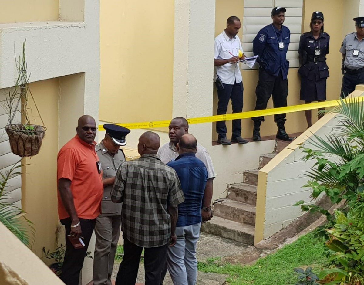Police officers at the crime scene at Embacadere, San Fernando. Photo: TREVOR WATSON