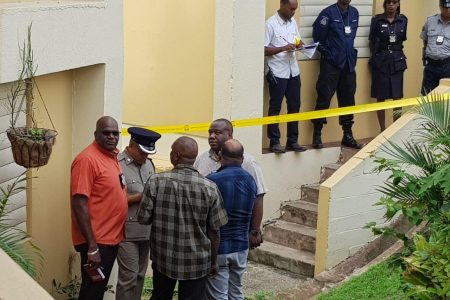 Police officers at the crime scene at Embacadere, San Fernando. Photo: TREVOR WATSON