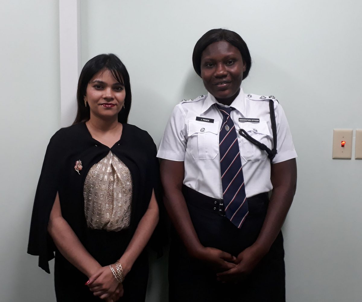 Legal Officer, Frontiers Division, Ministry of Foreign Affairs, Dianna Khan (left) and Officer-in-Charge of Ports of Entry, Immigration Department of the Guyana Police Force, Assistant Superintendent, Jeanette Prince at the Department of Citizenship.  (Ministry of the Presidency photo)
