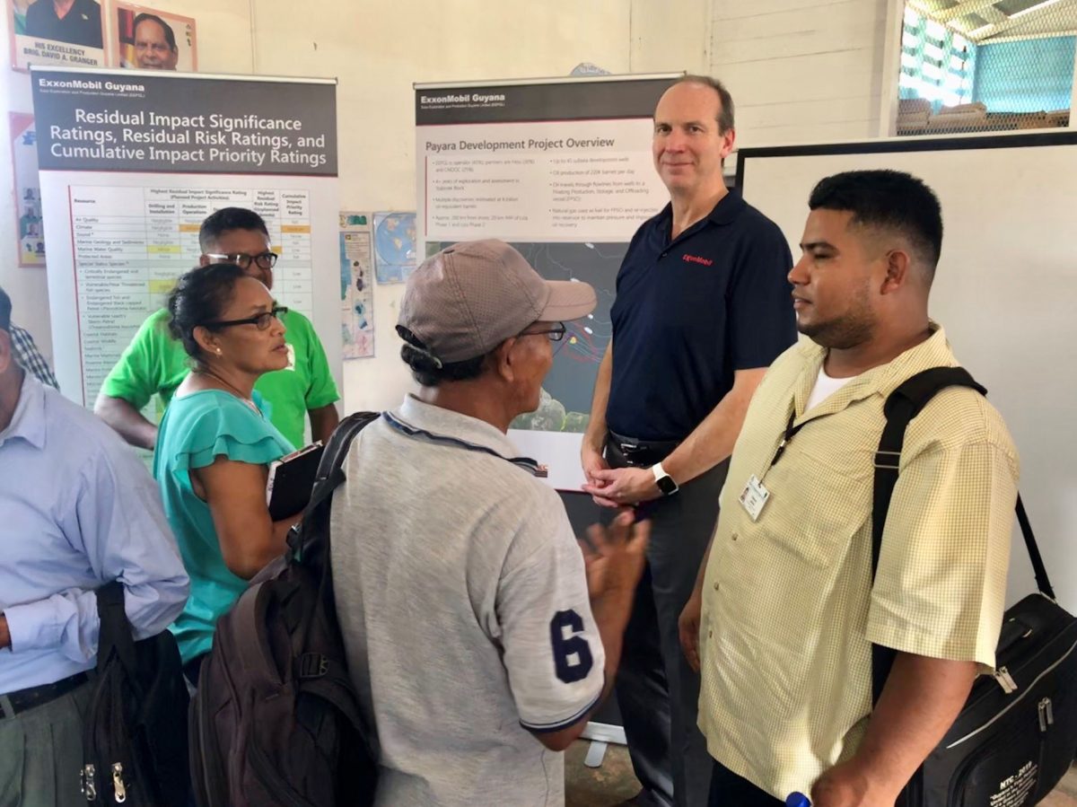 ExxonMobil’s Production Manager Mike Ryan (second from right) with residents at the end of the event 