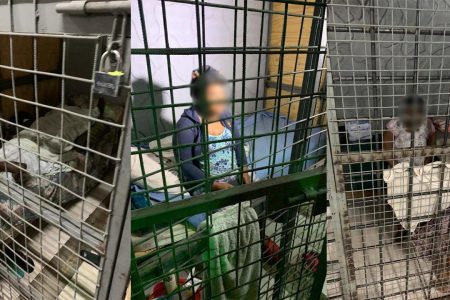 Three persons are seen in cages at the Transformed Rehabilitation Life Ministry Centre, where 69 persons were found at the facility in Arouca last night, during a police exercise.