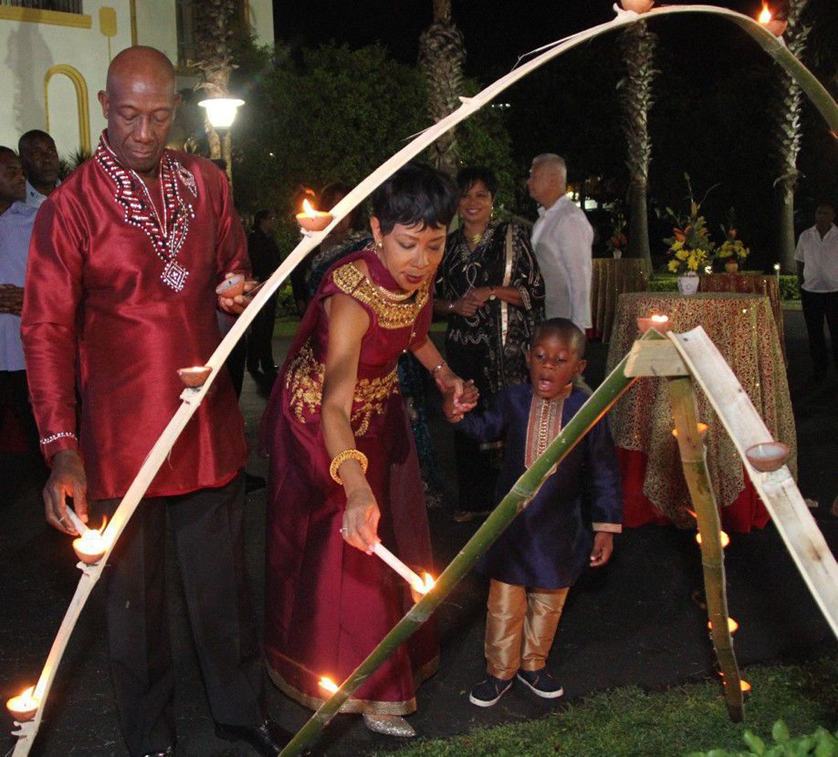 Trinidad & Tobago Prime Minister Dr Keith Rowley, his wife Mrs Sharon Rowley and their grandson light deyas at the Diplomatic Centre