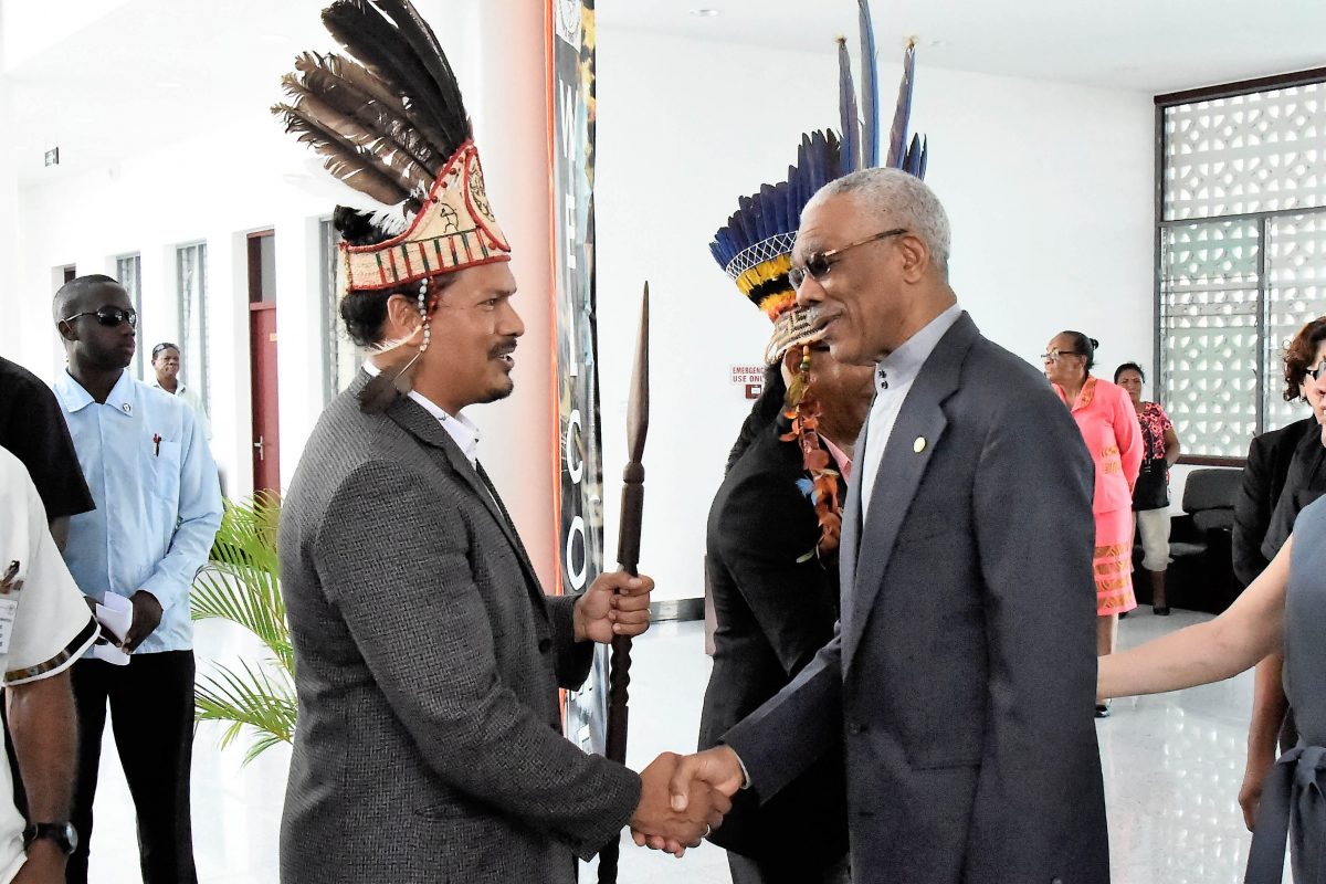 File photo: President David Granger greets Lennox Shuman at the opening of the NTC confab in 2018