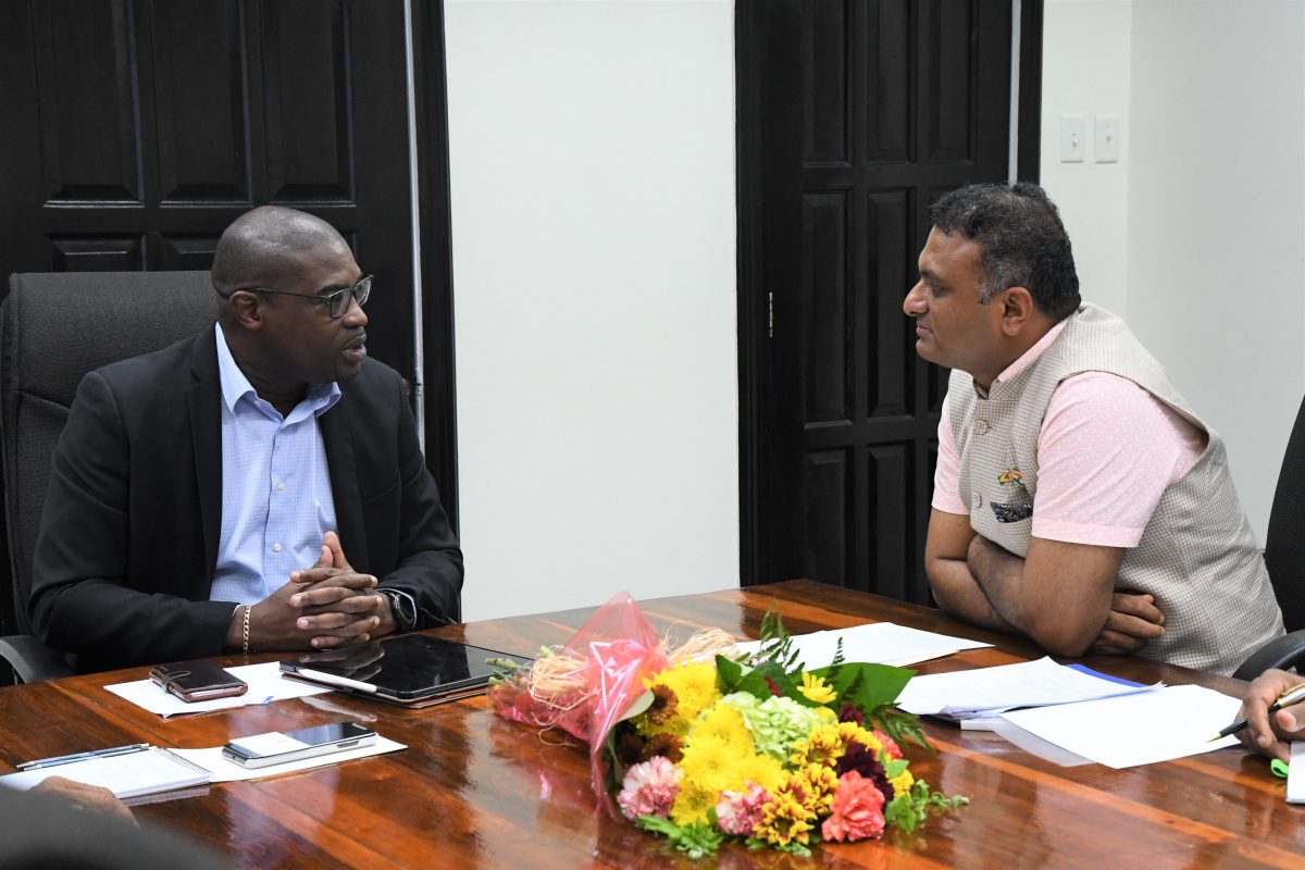 The new Indian High Commissioner to Guyana, Dr. K. J. Srinivasa (right) yesterday paid a courtesy call to on Minister of Public Infrastructure, David Patterson in the boardroom of the Ministry’s Wight’s Lane, Kingston, Georgetown office.
A release from the ministry said that during his visit, the High Commis-sioner reiterated India’s support to Guyana as he committed to offering scholarships to persons interested in studying there. He also highlighted  areas in which the Government of India is excited to participate in through funding. (Ministry of the Presidency photo)

