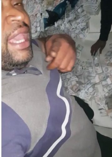 Police have labelled a man who is partially seen in a video in which men are counting an excessive amount of T&T hundred-dollar bills, a person of interest and are seeking the public’s help in identifying him.