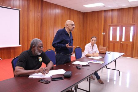 President of the Guyana Olympic Association K. Juman Yassin addresses the participants at Saturday’s forum at Olympic House, Liliendaal.
