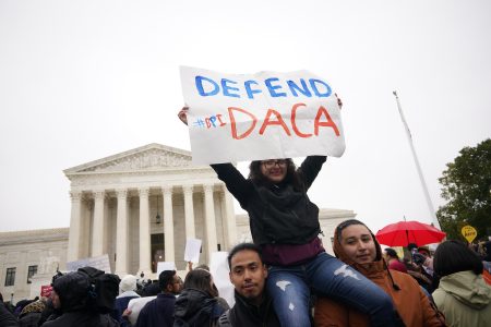 Immigration rights activists take part in a rally in front of the US Supreme Court in Washington, DC on November 12, 2019. – The US Supreme Court hears arguments on November 12, 2019 on the fate of the “Dreamers,” an estimated 700,000 people brought to the country illegally as children but allowed to stay and work under a program created by former president Barack Obama.Known as Deferred Action for Childhood Arrivals or DACA, the program came under attack from President Donald Trump who wants it terminated, and expired last year after the Congress failed to come up with a replacement. (Photo by MANDEL NGAN / AFP) (Photo by MANDEL NGAN/AFP via Getty Images)
