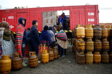 People line up to get a gas cylinder in El Alto on the outskirts of La Paz, Bolivia, yesterday. (REUTERS/David Mercado)
