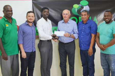 Petra Organisation representative Mark Alleyne collecting the sponsorship cheque from GCCS founder Aurelio Sella. Also in the photo from left to right are Lawrence Griffith; GCCS Admin Manager Marco Salvadore; GCCS Operations Manager Derrick Melville and Petra Organisation Co-Director Troy Mendonca.