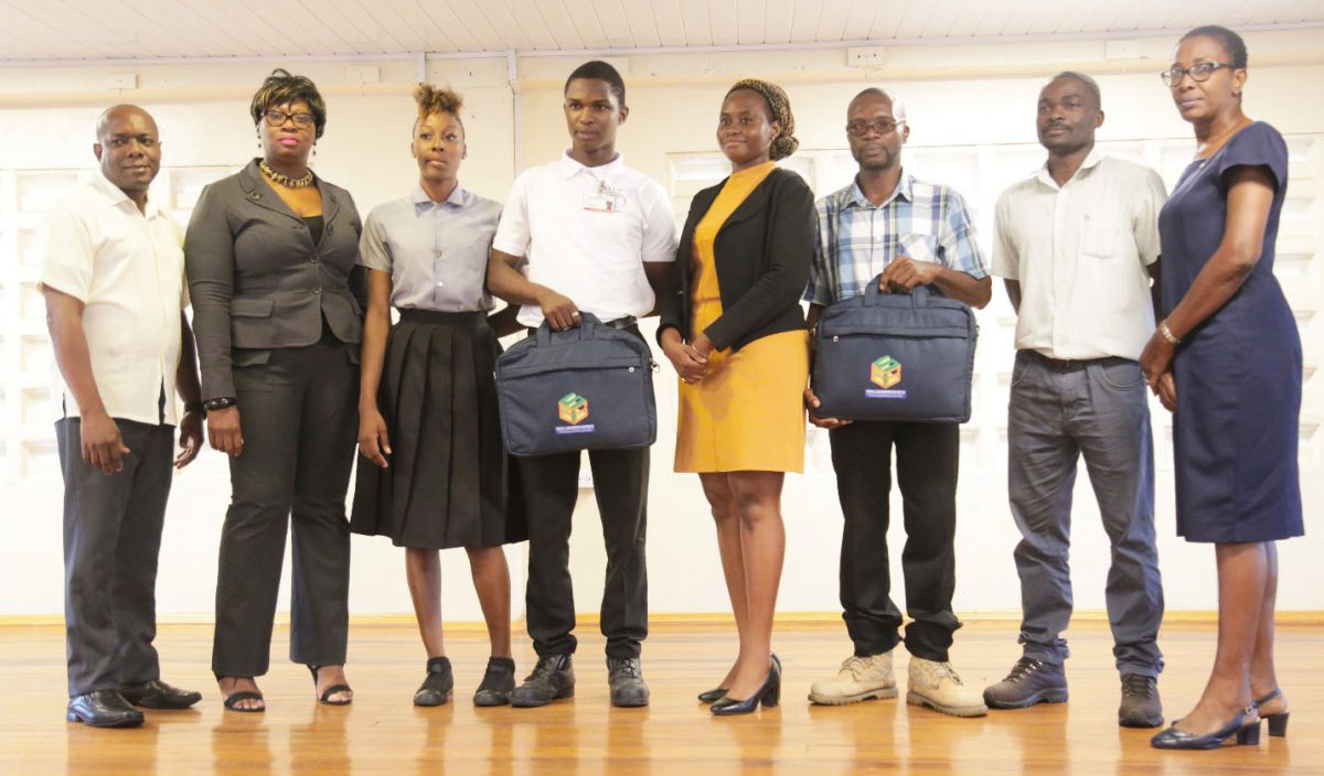From left are GITC Administrator Dexter Cornette, GITC Entrepreneurship Instructor Telitta Franklin, GITC competition participant Ornella Browne, Jameel Jacobs, Shamane Headley, Asante Waterton, who collected the grant on behalf of Collymore, competition participant Julius Cort and GITC Language and Communications Instructor Cheryl Ann Sam. 
