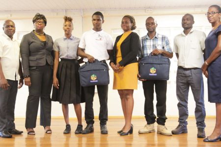 From left are GITC Administrator Dexter Cornette, GITC Entrepreneurship Instructor Telitta Franklin, GITC competition participant Ornella Browne, Jameel Jacobs, Shamane Headley, Asante Waterton, who collected the grant on behalf of Collymore, competition participant Julius Cort and GITC Language and Communications Instructor Cheryl Ann Sam.

