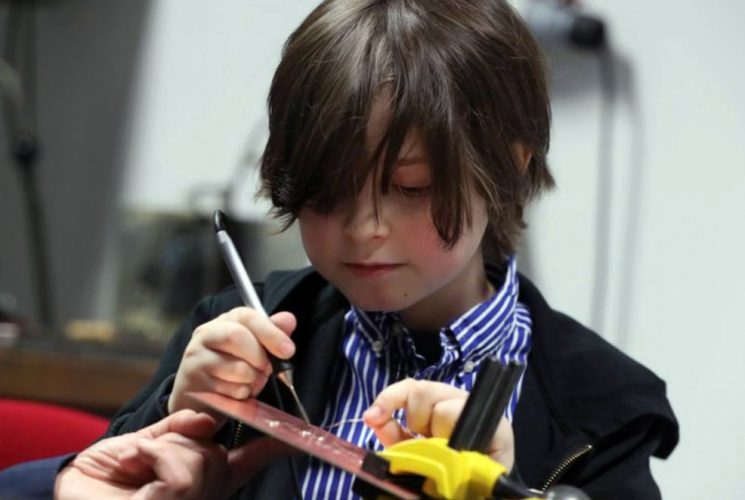 Nine-year-old Laurent Simons, who studies electrical engineering, is seen in the laboratory at the University of Eindhoven, Netherlands. He is set to become the youngest university graduate in the world. (REUTERS/Yves Herman photo) 