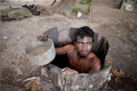 Paulo Paulino Guajajara is seen here drawing water from a well at a loggers camp on Arariboia indigenous land near the city of Amarante, Maranhao state, Brazil, September 11, 2019. (REUTERS/Ueslei Marcelino/File Photo)