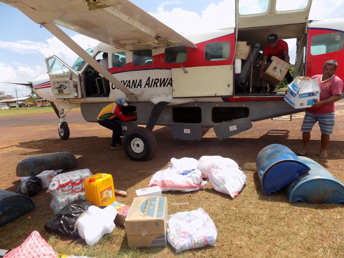  Trans Guyana unloading cargo at Kamarang airstrip