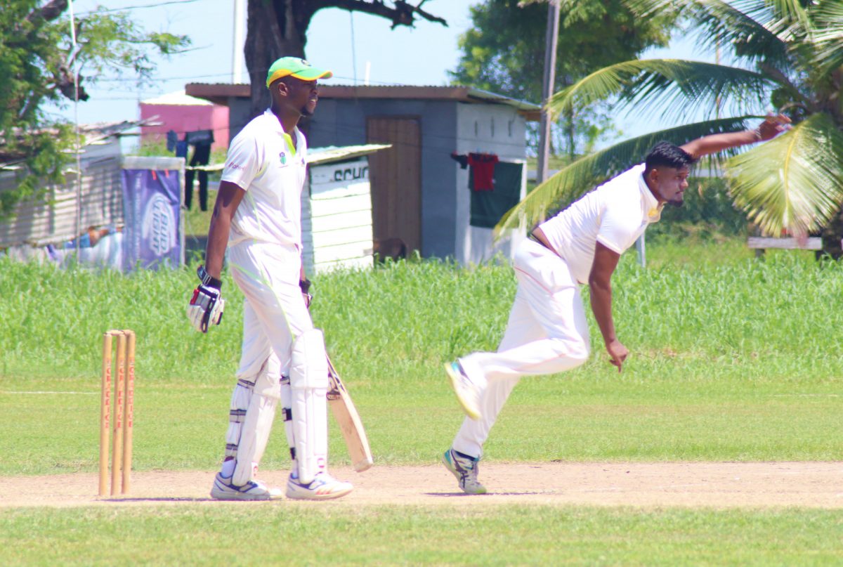 Everest’s Amir Khan bowls against GNIC where he picked up a match haul of 15-70. (Romario Samaroo photo)
