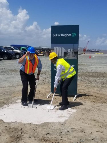 Philip Fernandes, CEO of John Fernandes Ltd (left) and  Uwem Ukpong, COO of Baker Hughes, breaking ground at the  GPort facility, which JFL states was “in support of the growing Oil Sector”. (Photo- JFL’s Facebook Page.) 