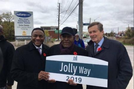 B. Denham Jolly (centre) with Mayor John Tory (right) and Deputy Mayor Michael Thompson at the unveiling of a sign officially naming a street Jolly Way in honour of Jolly, the Jamaica-born philanthropist, in February.