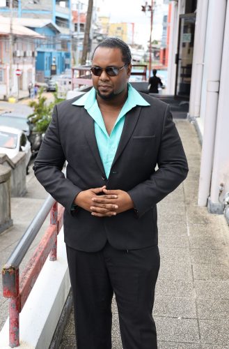 Clint Atong leaves the San Fernando High Court yesterday after winning his police brutality case. 