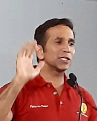 Attorney General Faris Al-Rawi address suppporters during the PNM’s public meeting at the CAL Skiffle Steel Orchestra panyard in San Fernando earlier this week.