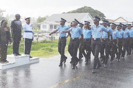 Scattered showers along the Essequibo Islands-West Demerara did not prevent the Regional Administration from its annual Remembrance Day observance at the Stewartville Monument Site on the West Coast of Demerara on Sunday.
In photo: Members of the Guyana Police Force ‘D’ Division, taking the salute from Member of Parliament John Adams and Regional Executive Officer, Jennifer Ferreira-Dougall (left) and Commander Simon Mc Bean. (Department of Public Information photo)
