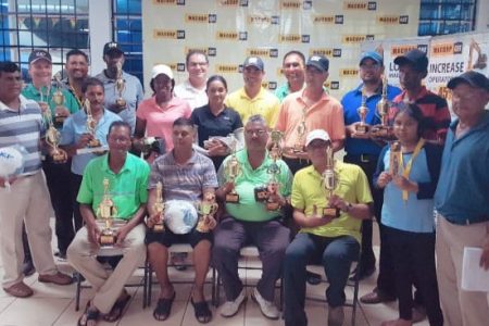 Tournament winners pose for a photo with MACORP’s CEO Guillermo Escarraga and other company and LGC officials.  
